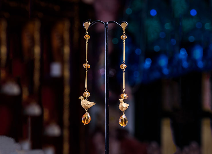 Unique 18ct gold earrings featuring gold birds and citrine stones