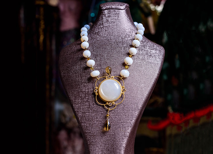 Unique 18ct gold necklace with labradorites, smoky quartz, and a moonstone charm with 0.05ct brilliants